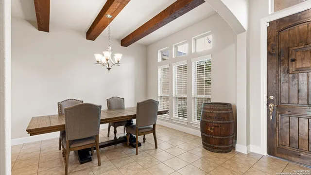 a dining room with furniture and window