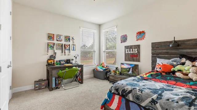 a bed room with furniture and a window