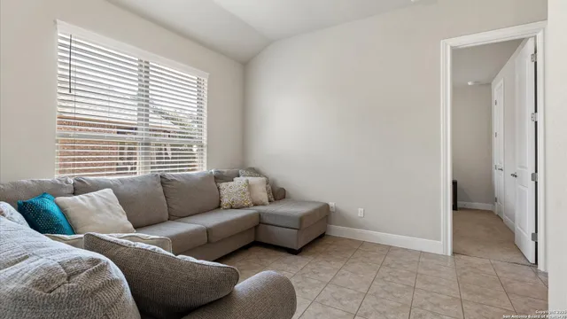 a living room with furniture and a window