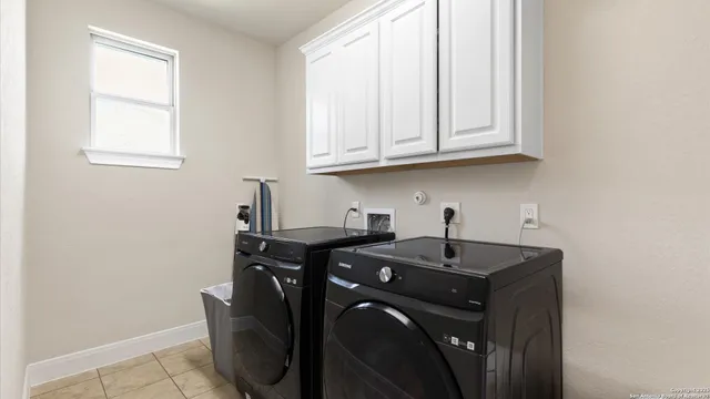 a view of a sink storage and utility