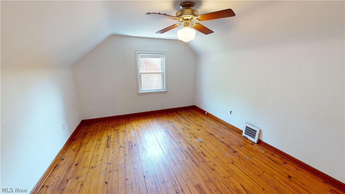 4334 West Anderson Road South Euclid, OH 44121 - Photo 8 of 12 Bedroom with ceiling fan, vaulted ceiling, and hardwood flooring