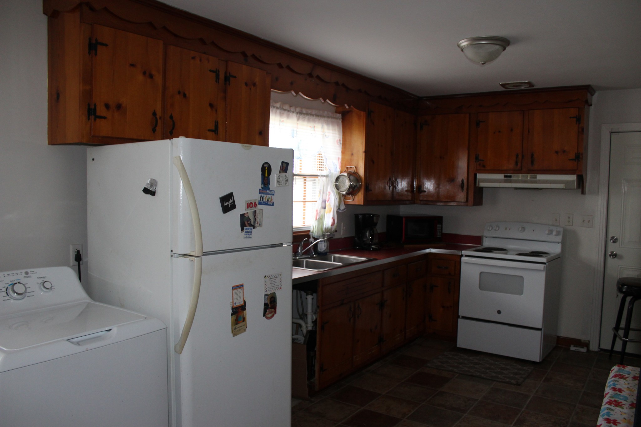 317 Pitt Lane Springfield, TN 37172 - Photo 8 of 22 a white refrigerator freezer sitting inside of a kitchen