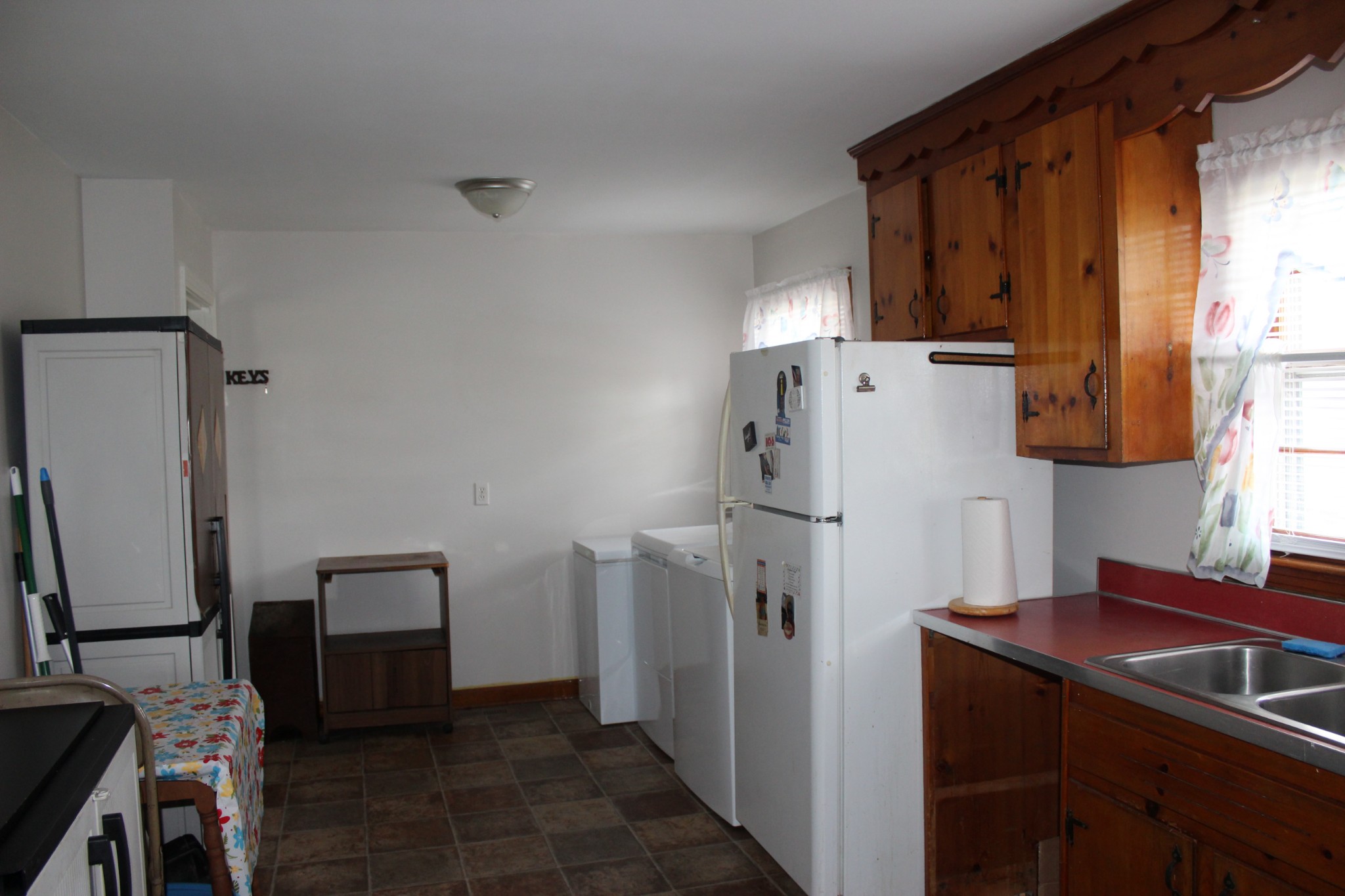 317 Pitt Lane Springfield, TN 37172 - Photo 9 of 22 a kitchen with refrigerator a washer and dryer