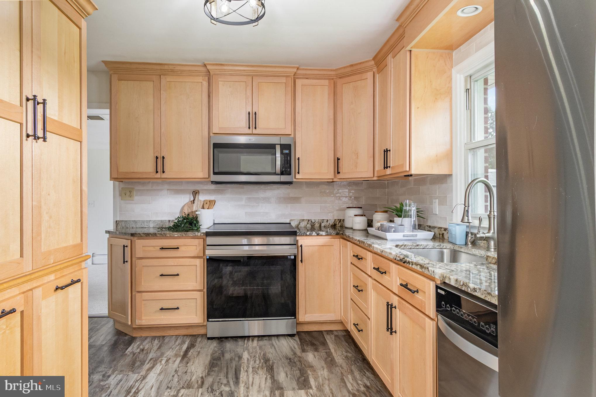2507 Jerusalem Road Joppa, MD 21085 - Photo 17 of 50 a kitchen with stainless steel appliances granite countertop a stove and a sink