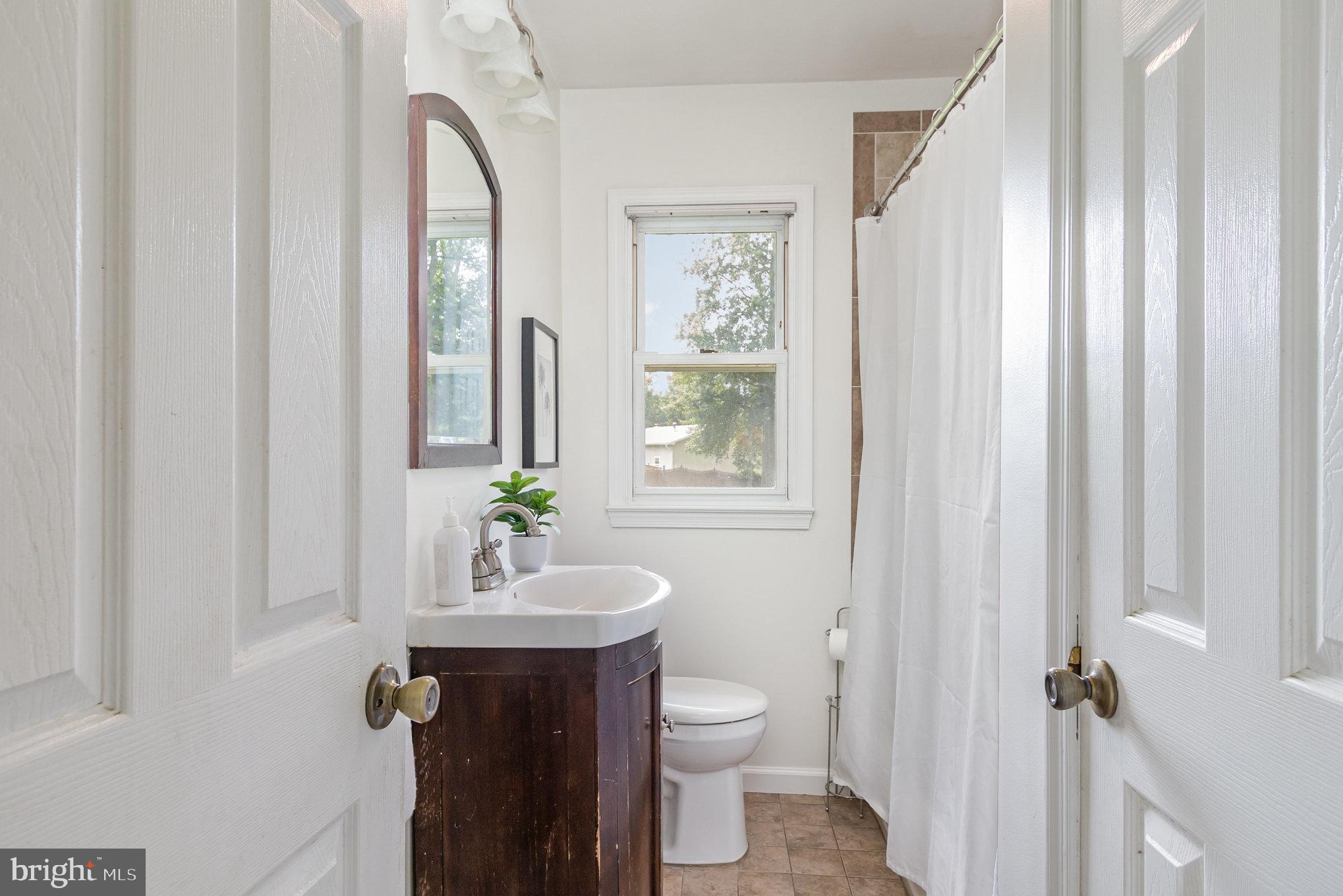 2507 Jerusalem Road Joppa, MD 21085 - Photo 27 of 50 a bathroom with a sink a toilet and shower