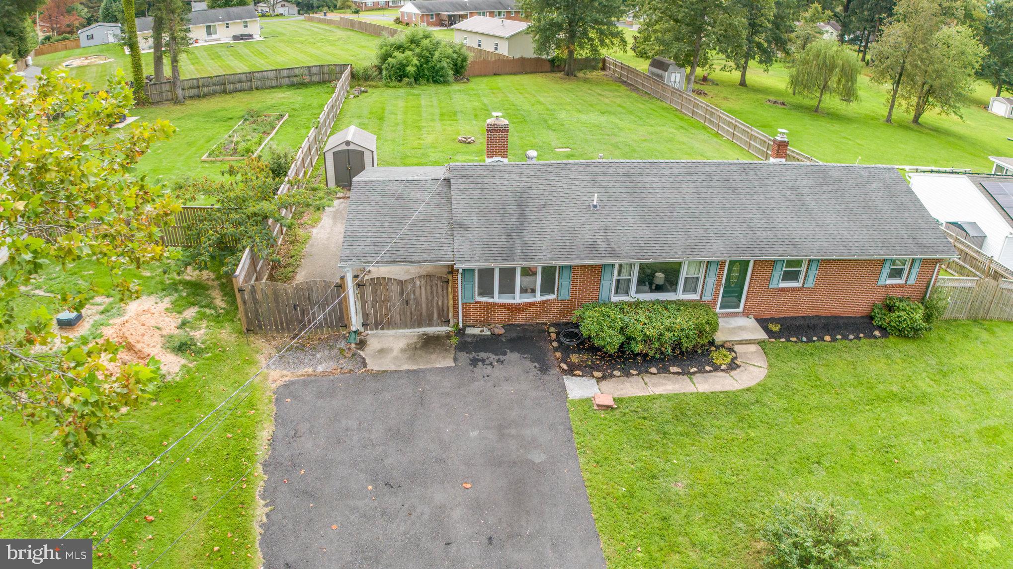 2507 Jerusalem Road Joppa, MD 21085 - Photo 6 of 50 a view of backyard with table and chairs and potted plants