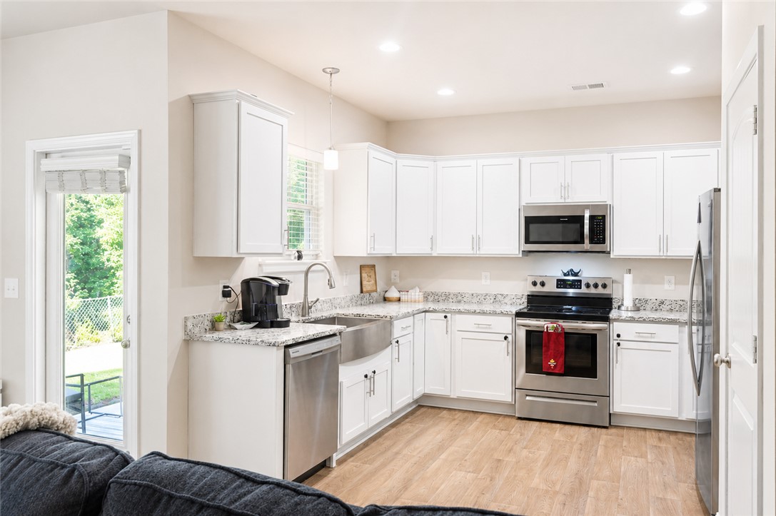 102 Ventura Street Anderson, SC 29621 - Photo 9 of 24 Culinary delights await in this bright kitchen, complete with stainless appliances and sleek counters.
