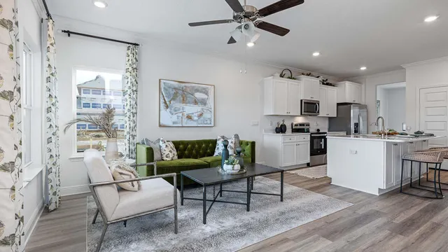 a kitchen with stainless steel appliances a stove a sink and a microwave