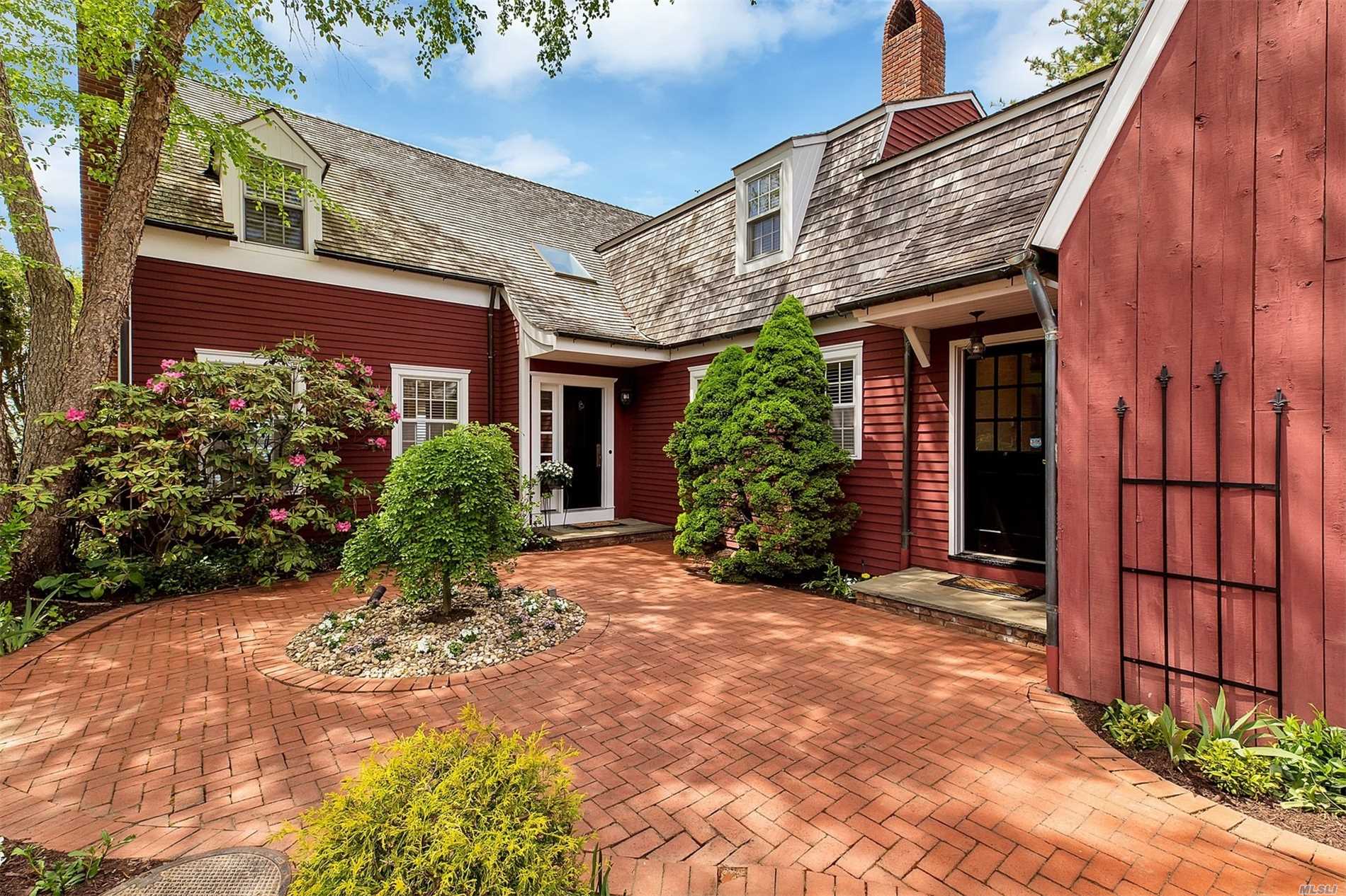 4 Waters Edge Port Washington, NY 11050 - Photo 1 of 1 a view of a house with potted plants