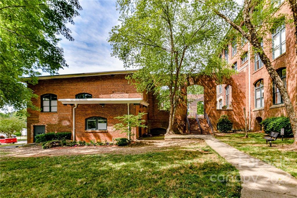 201 South Hoskins Road, Unit 106 Charlotte, NC 28208 - Photo 17 of 18 a view of a house with basketball court