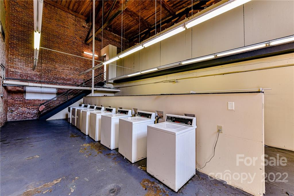 201 South Hoskins Road, Unit 106 Charlotte, NC 28208 - Photo 18 of 18 a utility room with dryer and washer