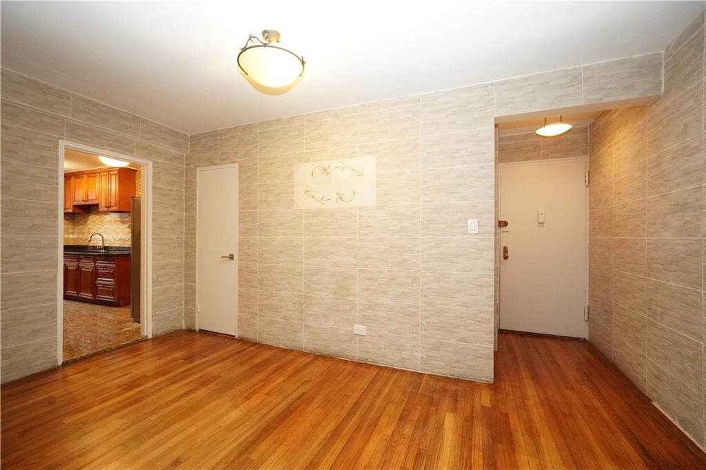345 Webster Avenue, Unit 3N Brooklyn, NY 11230 - Photo 4 of 10 a view of a room with wooden floor and window