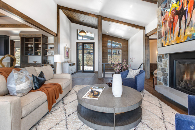 1282 Chimney Rock Road, Unit 344 Heber City, UT 84032 - Photo 5 of 55 Vaulted ceilings with exposed wood beams define this living area, featuring a stone fireplace with a substantial mantel