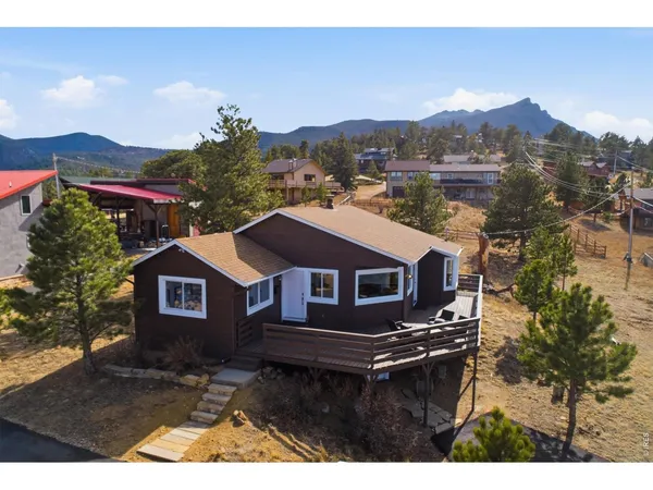 a aerial view of a house with a yard