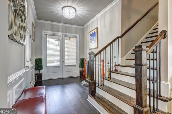 a kitchen with kitchen island granite countertop a sink cabinets stainless steel appliances and a counter top space