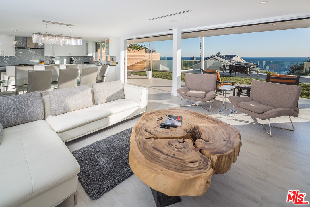 31528 Broad Beach Road Malibu, CA 90265 - Photo 11 of 26 a living room with furniture and a wooden floor