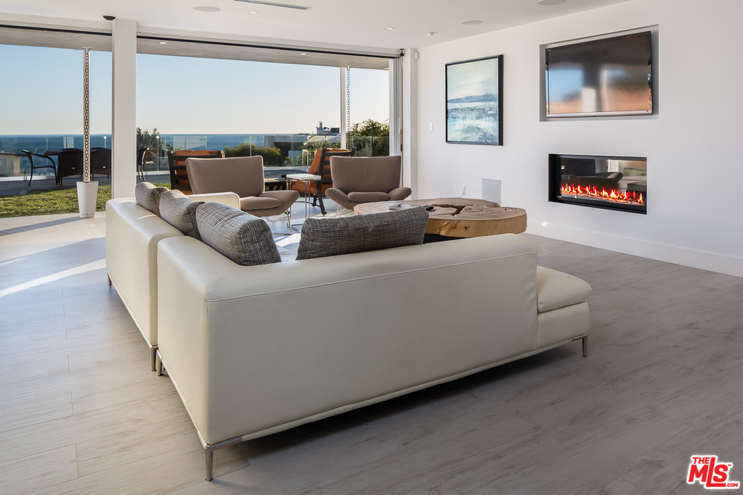 31528 Broad Beach Road Malibu, CA 90265 - Photo 12 of 26 a living room with furniture and a flat screen tv