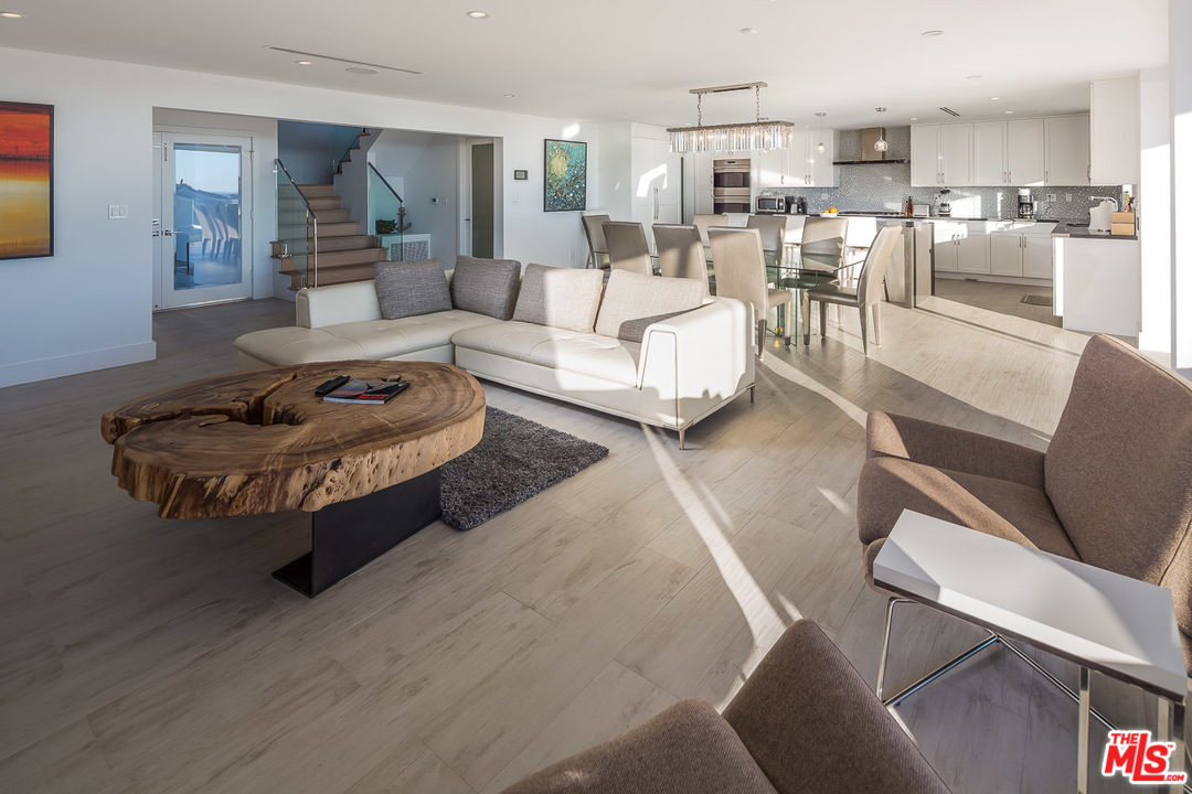 31528 Broad Beach Road Malibu, CA 90265 - Photo 14 of 26 a living room with furniture wooden floor and a table