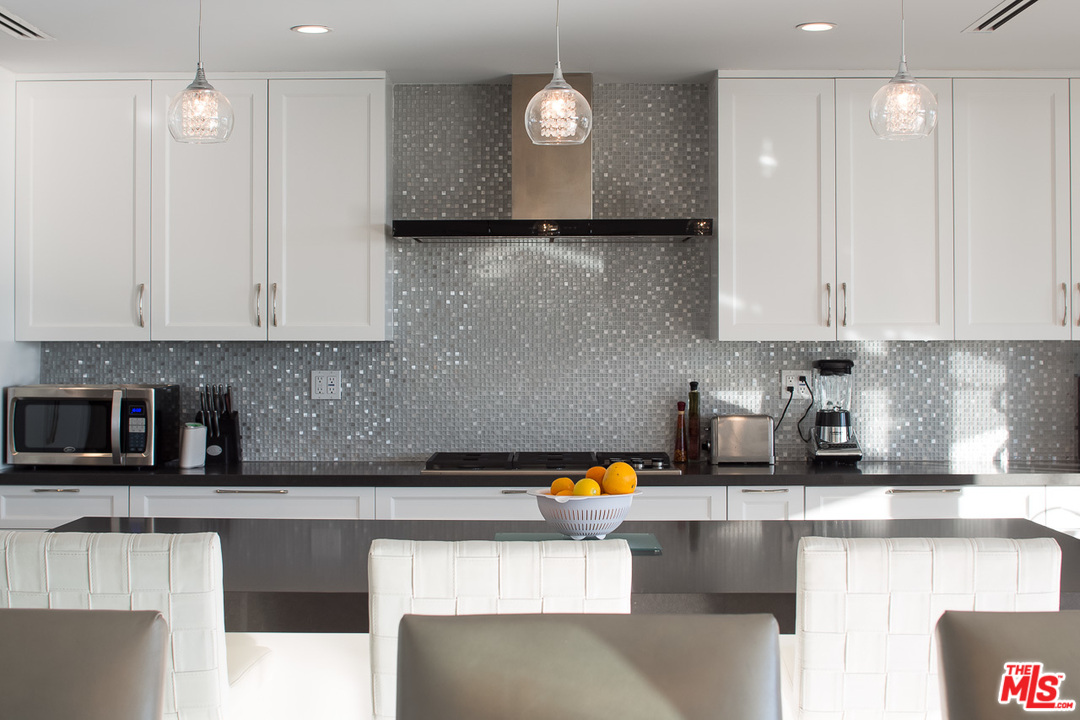31528 Broad Beach Road Malibu, CA 90265 - Photo 16 of 26 a kitchen with stainless steel appliances granite countertop a sink a stove and a granite counter tops