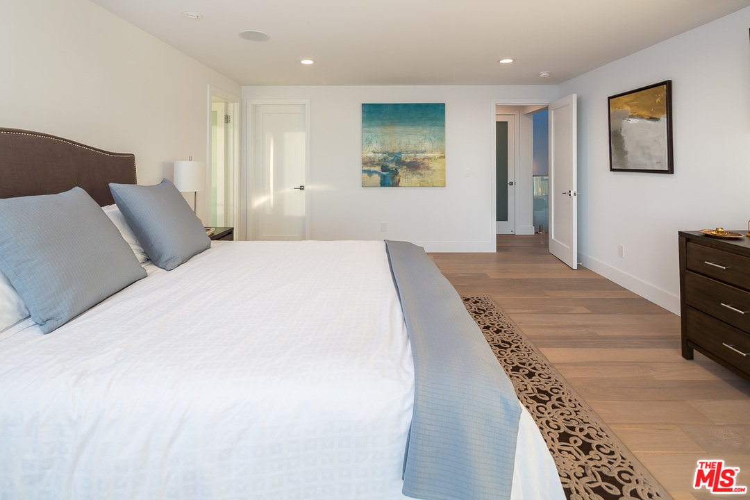 31528 Broad Beach Road Malibu, CA 90265 - Photo 21 of 26 a bedroom with a bed and a dresser