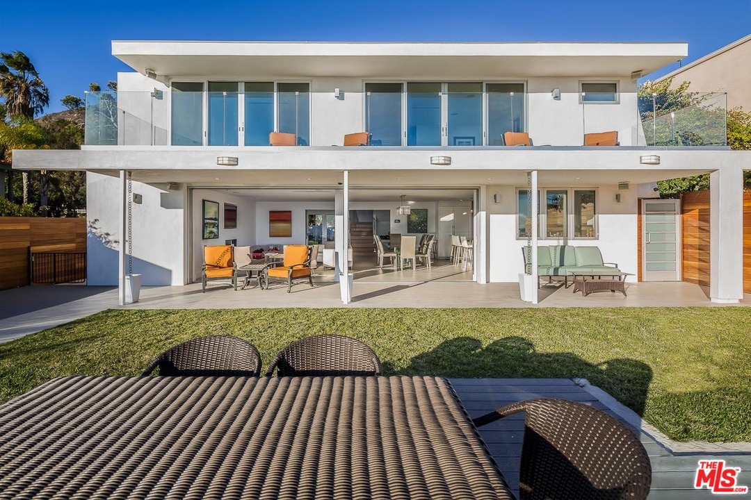 31528 Broad Beach Road Malibu, CA 90265 - Photo 8 of 26 a view of a house with a swimming pool and sitting area