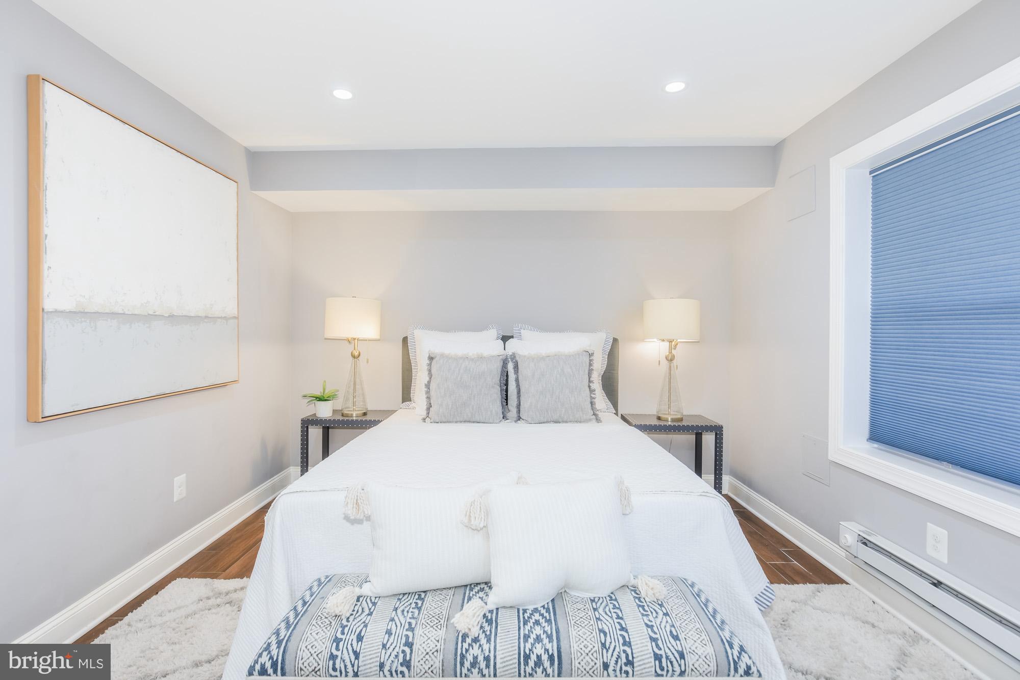 3803 10th Street Northwest, Unit 1 Washington, DC 20011 - Photo 51 of 71 a large white bed in a white room