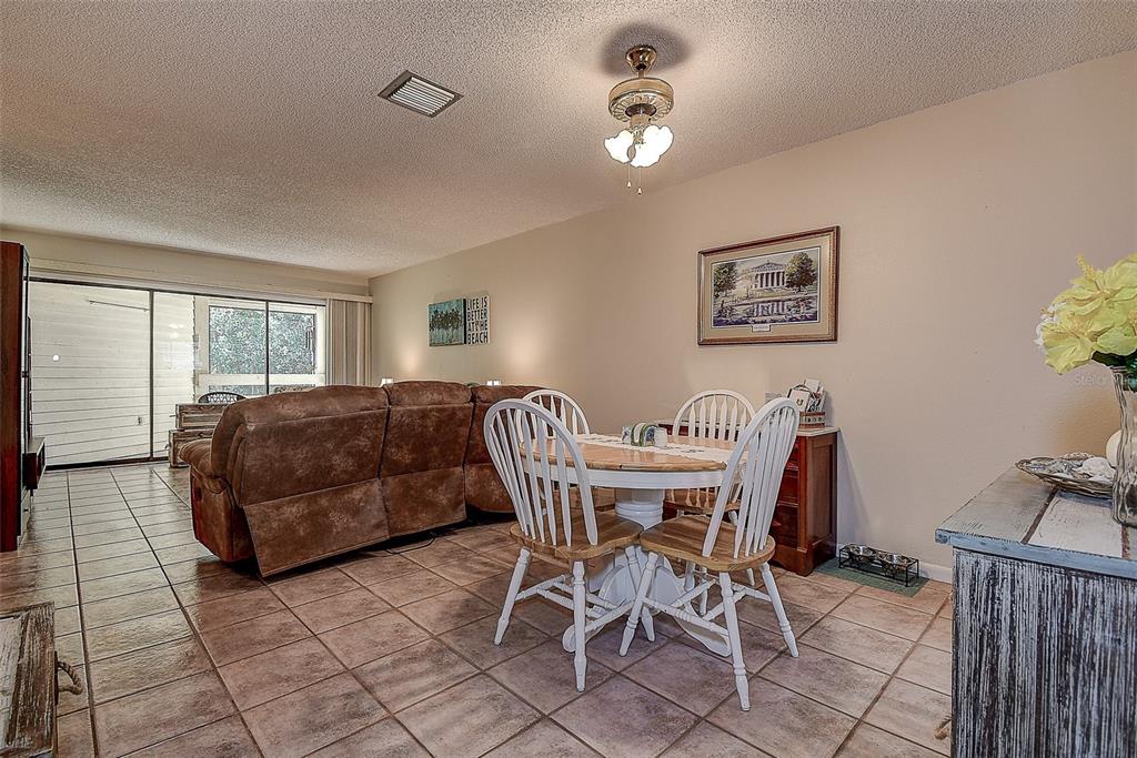 1500 Sunset Road, Unit G4 Tarpon Springs, FL 34689 - Photo 11 of 44 a view of a livingroom with furniture and a window