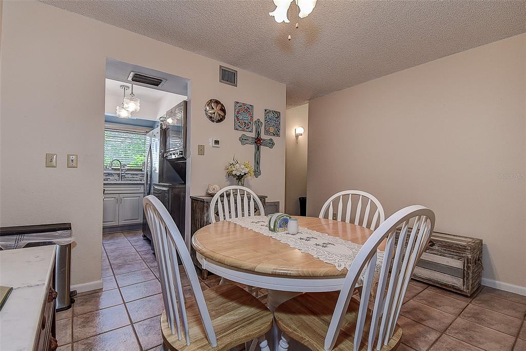 1500 Sunset Road, Unit G4 Tarpon Springs, FL 34689 - Photo 12 of 44 a view of a dining room with furniture