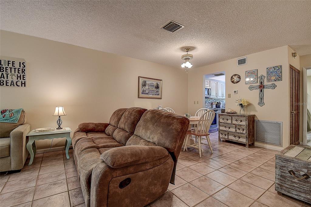 1500 Sunset Road, Unit G4 Tarpon Springs, FL 34689 - Photo 9 of 44 a living room with furniture and a couch