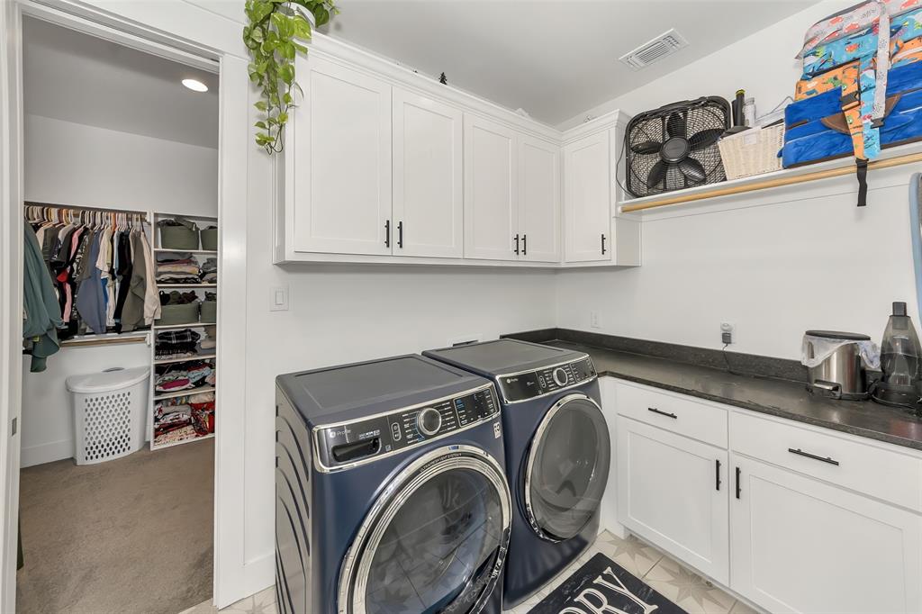 1040 Agnes Street North Springtown, TX 76082 - Photo 20 of 40 Laundry room featuring washer and dryer and cabinet space