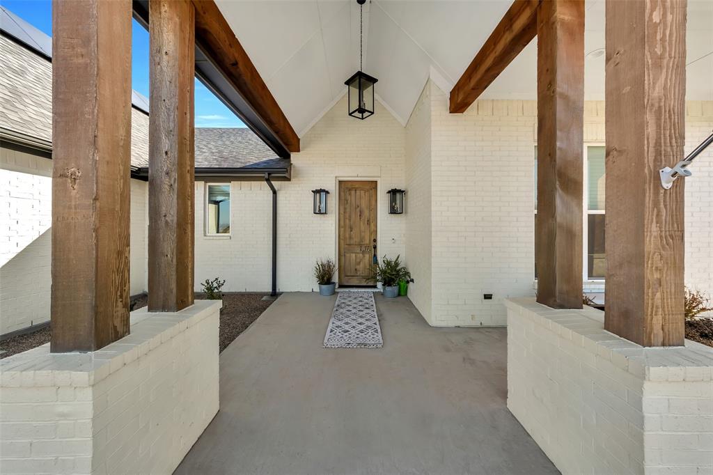 1040 Agnes Street North Springtown, TX 76082 - Photo 2 of 40 Entrance to property with a porch and brick siding