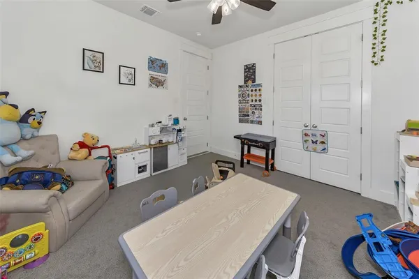 a bedroom with bed and a window