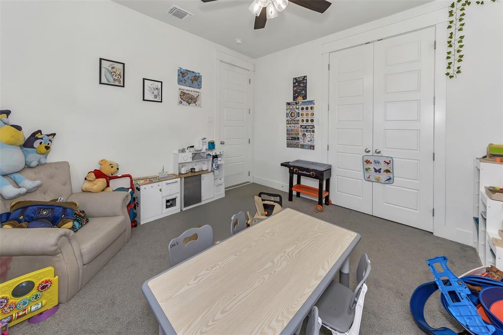 1040 Agnes Street North Springtown, TX 76082 - Photo 27 of 40 Recreation room with carpet flooring and ceiling fan