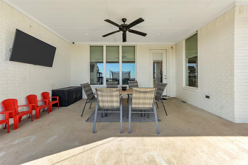 1040 Agnes Street North Springtown, TX 76082 - Photo 32 of 40 View of patio featuring outdoor dining space and ceiling fan