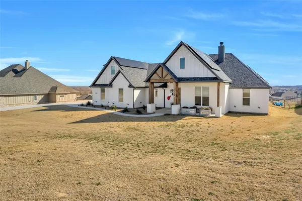 a front view of a house with yard