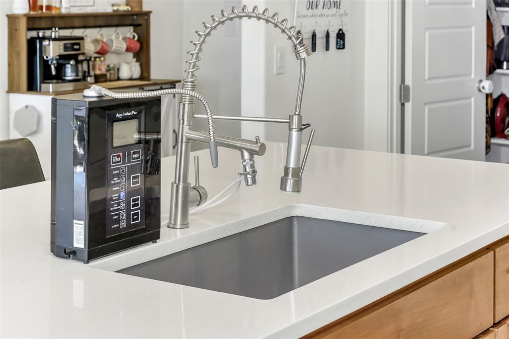 1040 Agnes Street North Springtown, TX 76082 - Photo 10 of 40 Kitchen view of a sink and black microwave