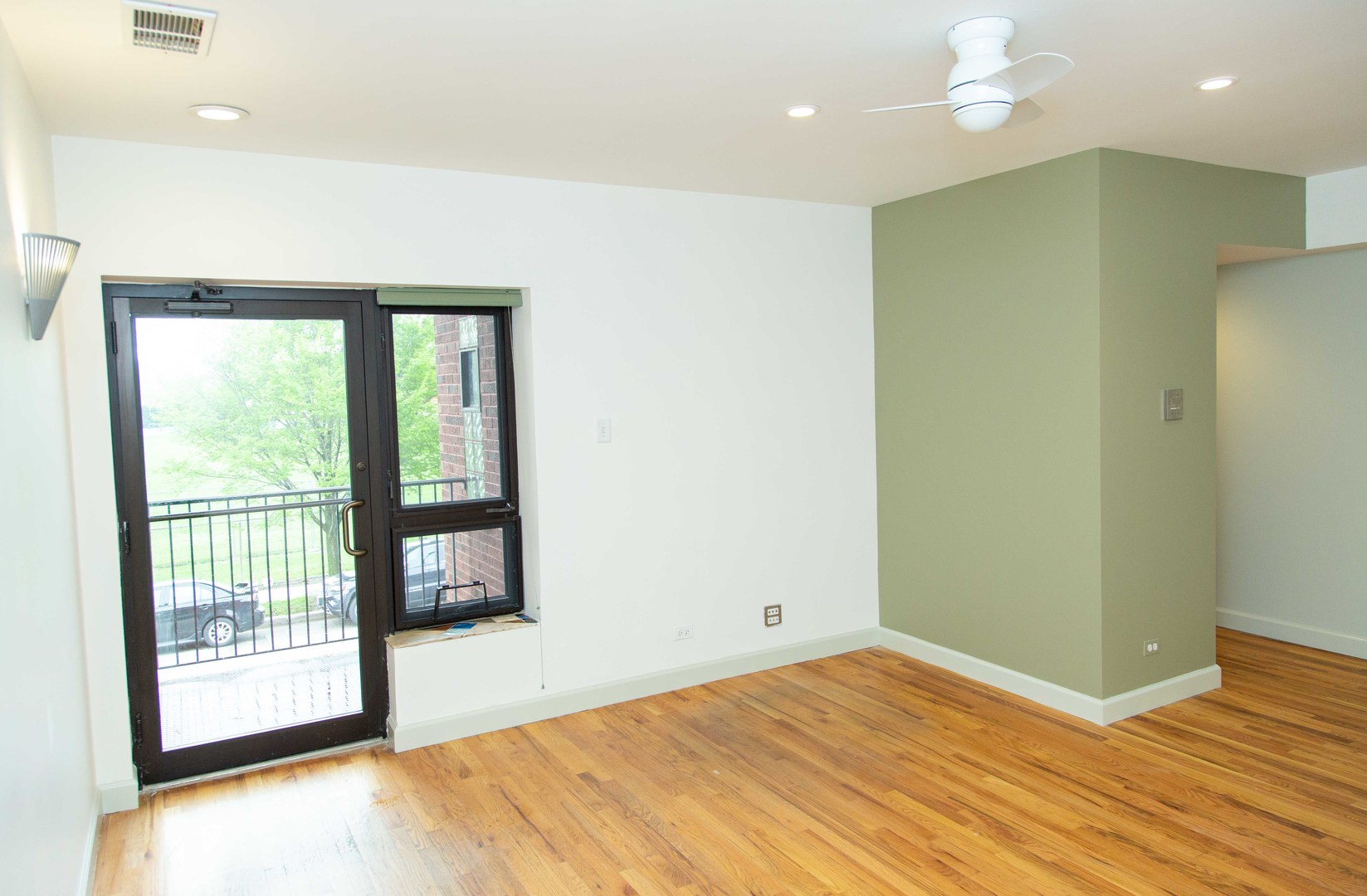 1607 Simpson Street, Unit 2E Evanston, IL 60201 - Photo 5 of 21 a view of an empty room with a window