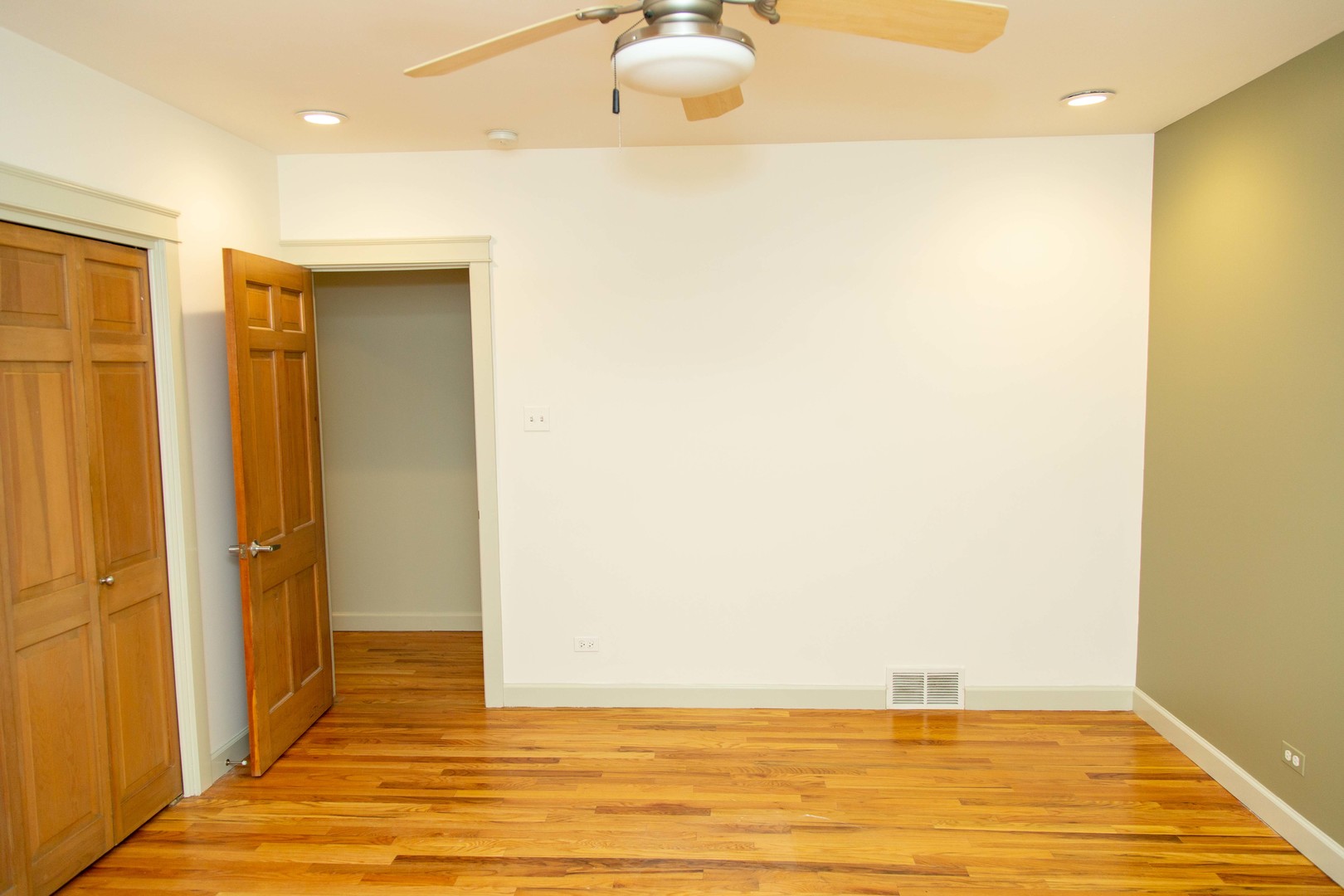 1607 Simpson Street, Unit 2E Evanston, IL 60201 - Photo 9 of 21 a view of a livingroom with wooden floor