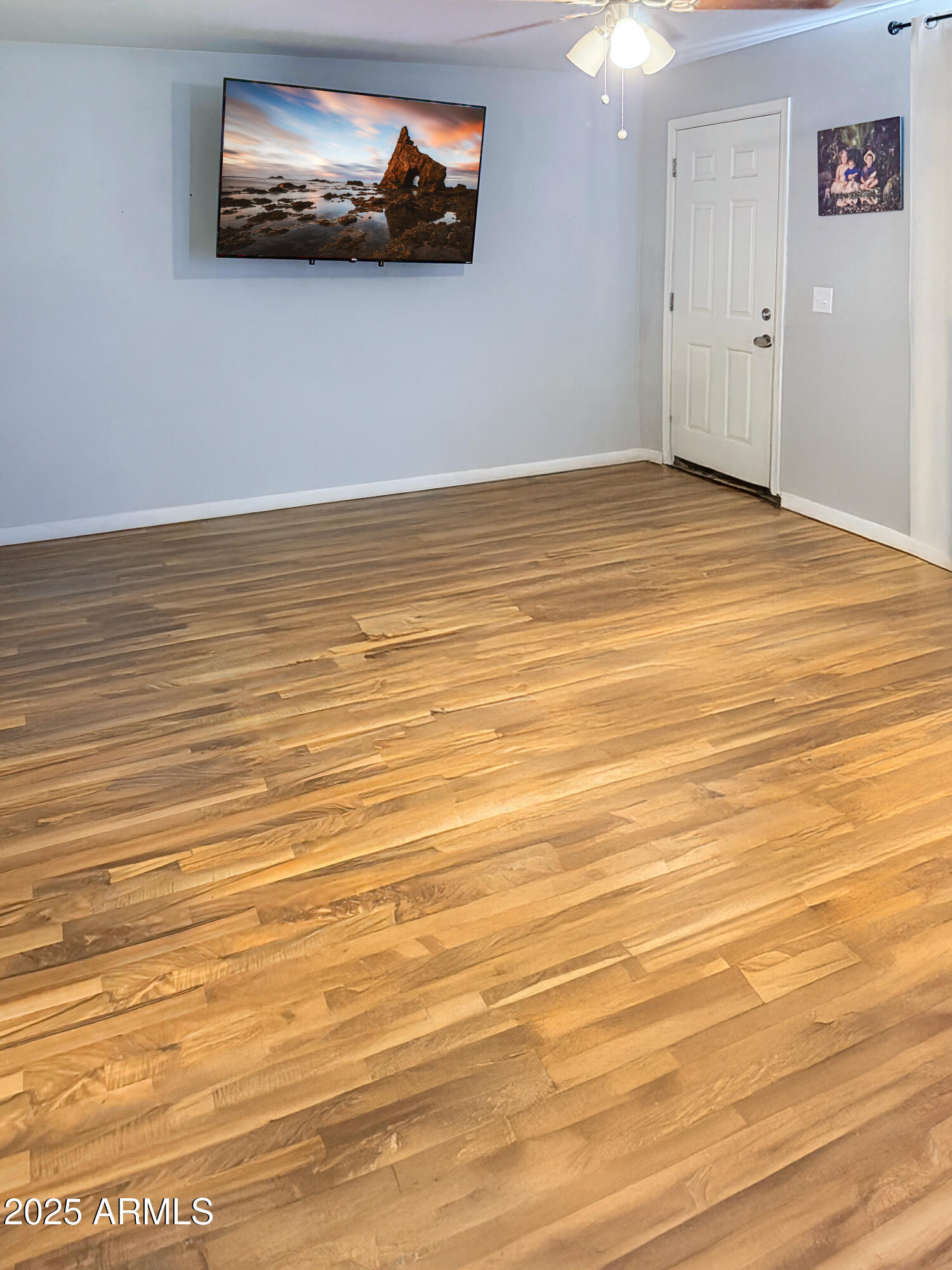 310-312 4th Street Winkelman, AZ 85192 - Photo 8 of 13 a view of an empty room with wooden floor