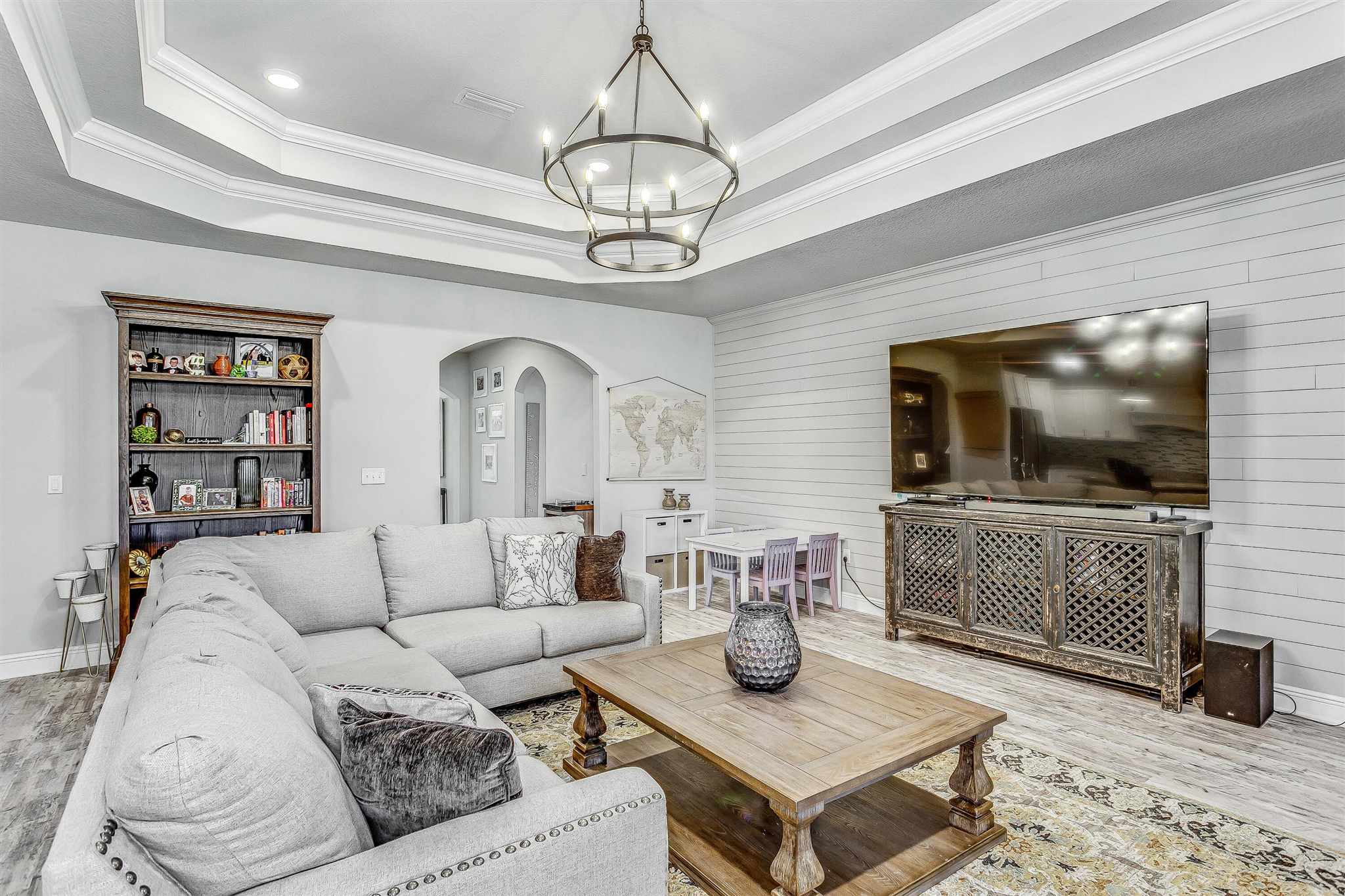 2792 Elkhorn Drive Pace, FL 32571 - Photo 13 of 50 a living room with furniture and a flat screen tv
