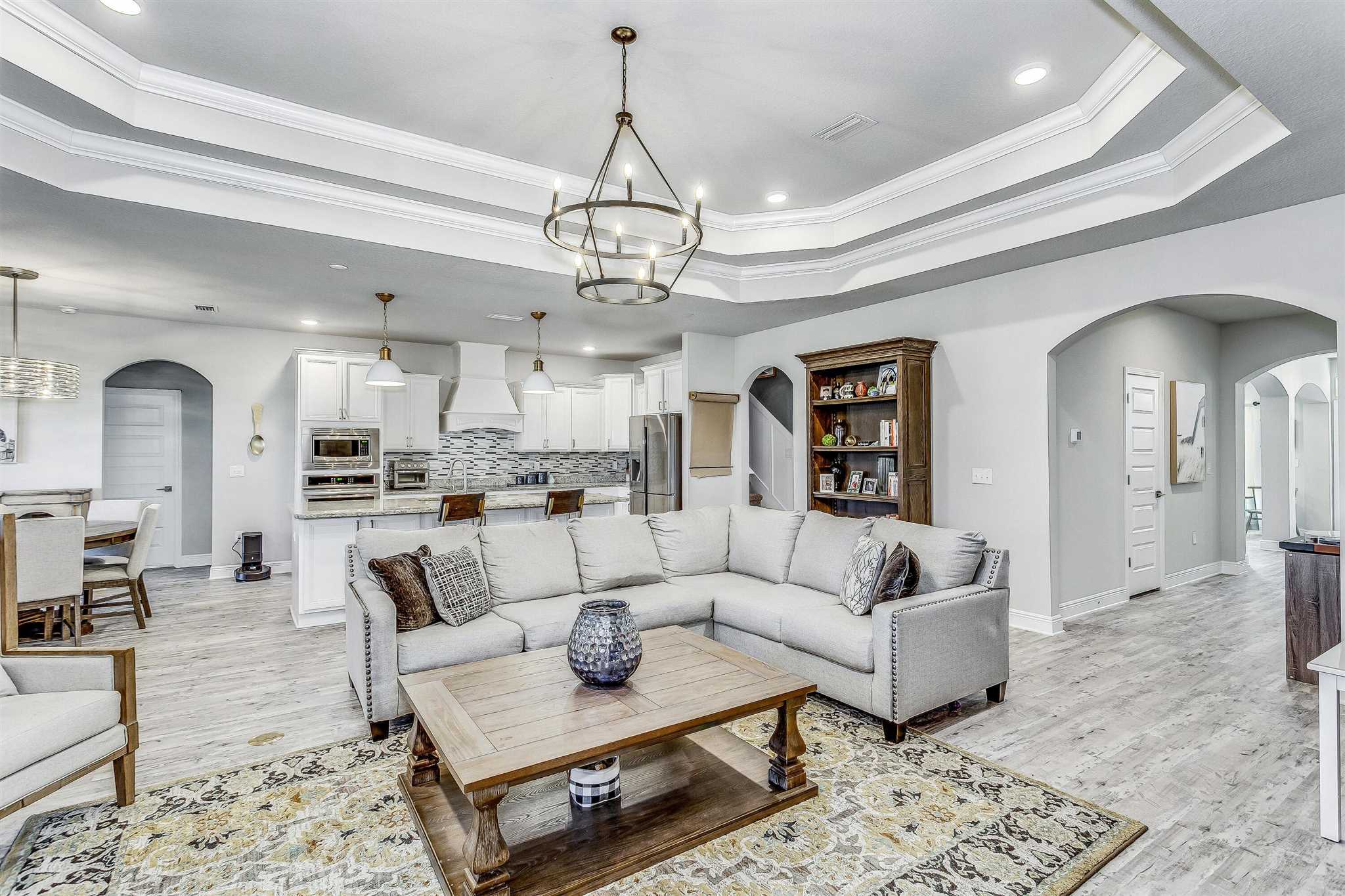 2792 Elkhorn Drive Pace, FL 32571 - Photo 14 of 50 a living room with furniture chandelier and view of kitchen