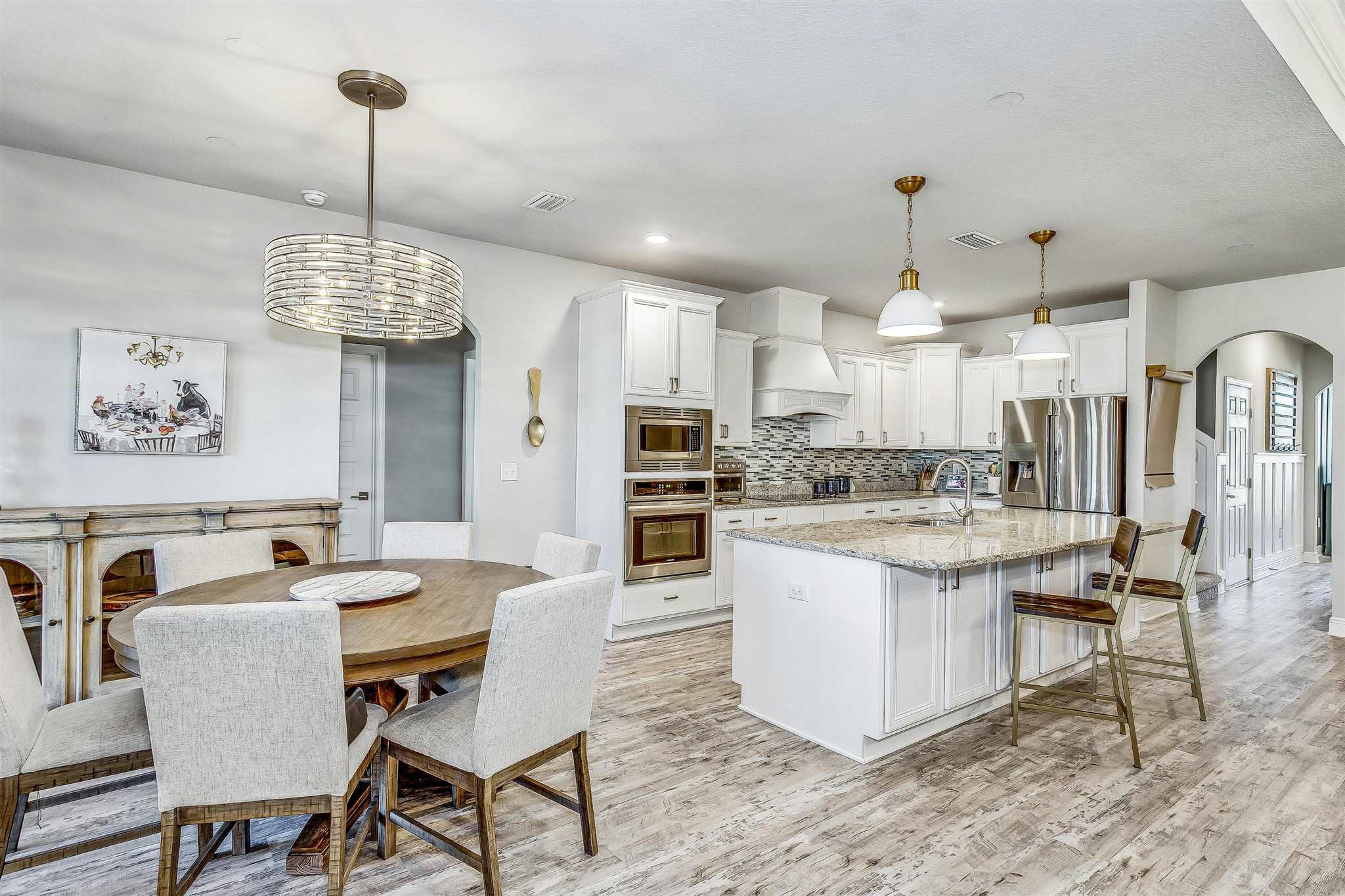 2792 Elkhorn Drive Pace, FL 32571 - Photo 15 of 50 a large kitchen with a table and chairs