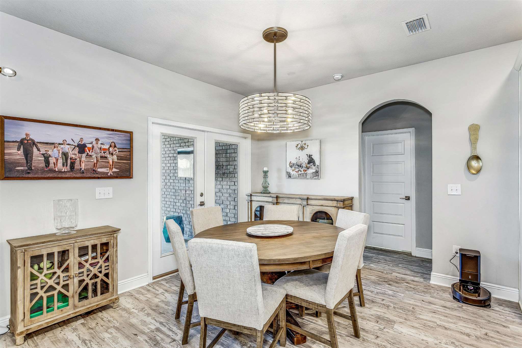 2792 Elkhorn Drive Pace, FL 32571 - Photo 17 of 50 a dining room with furniture a window and wooden floor