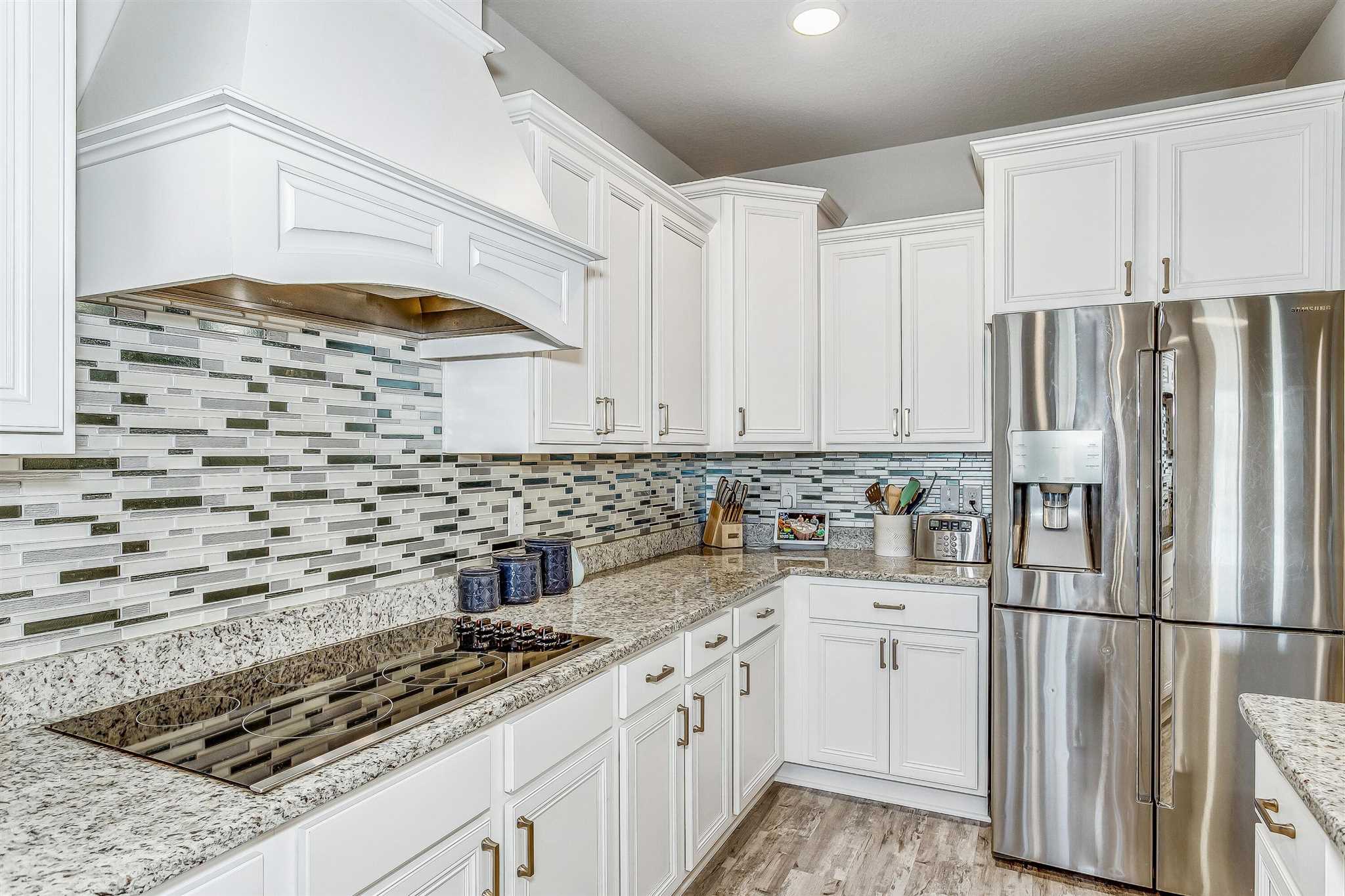 2792 Elkhorn Drive Pace, FL 32571 - Photo 19 of 50 a kitchen with stainless steel appliances a refrigerator sink and cabinets