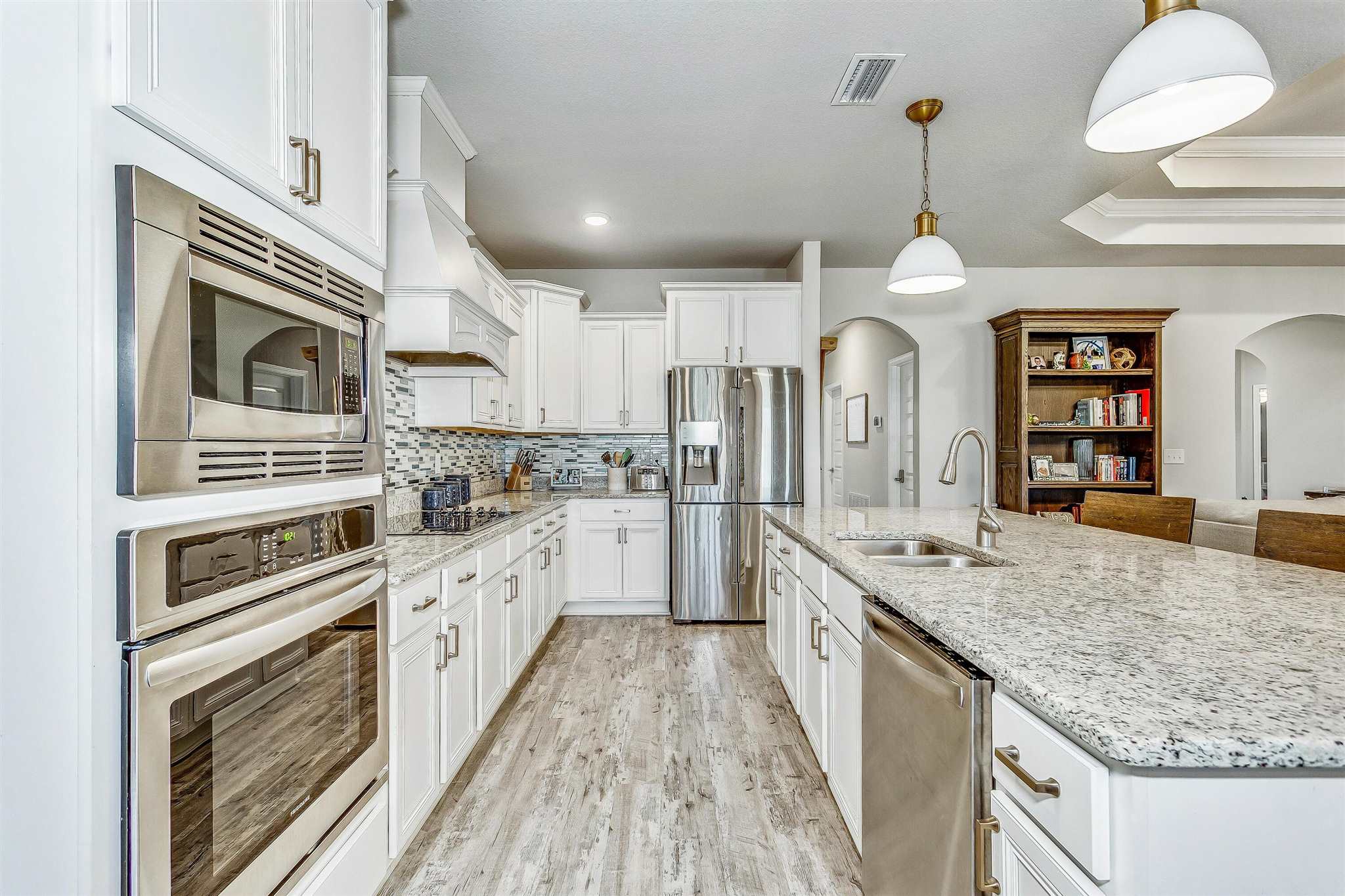 2792 Elkhorn Drive Pace, FL 32571 - Photo 20 of 50 a kitchen with stainless steel appliances granite countertop a stove oven and a refrigerator