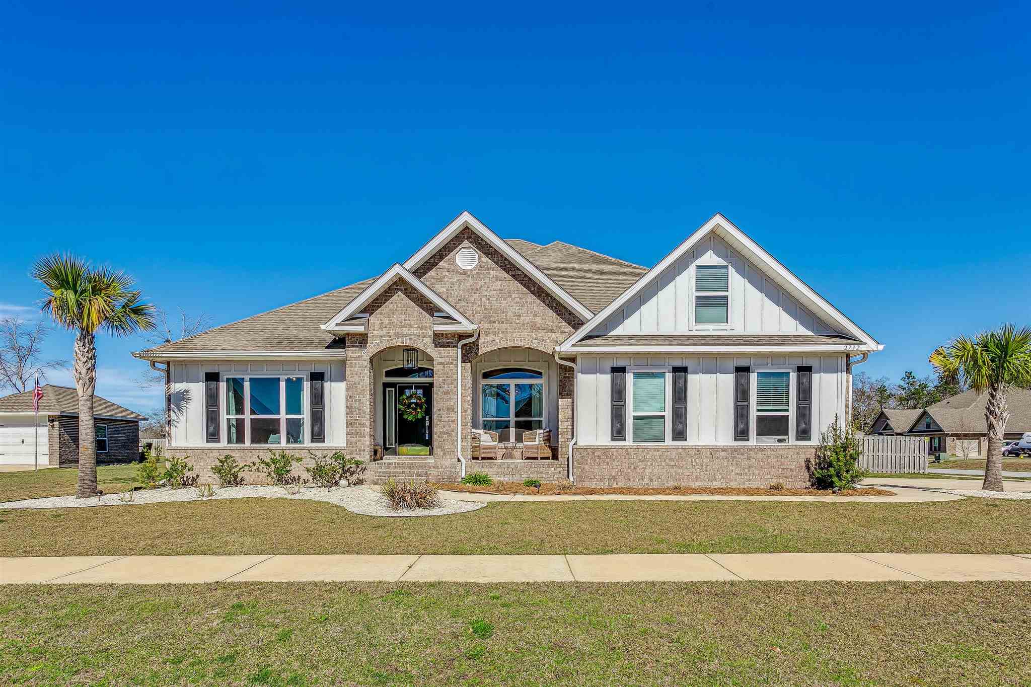 2792 Elkhorn Drive Pace, FL 32571 - Photo 2 of 50 a front view of a house with a yard