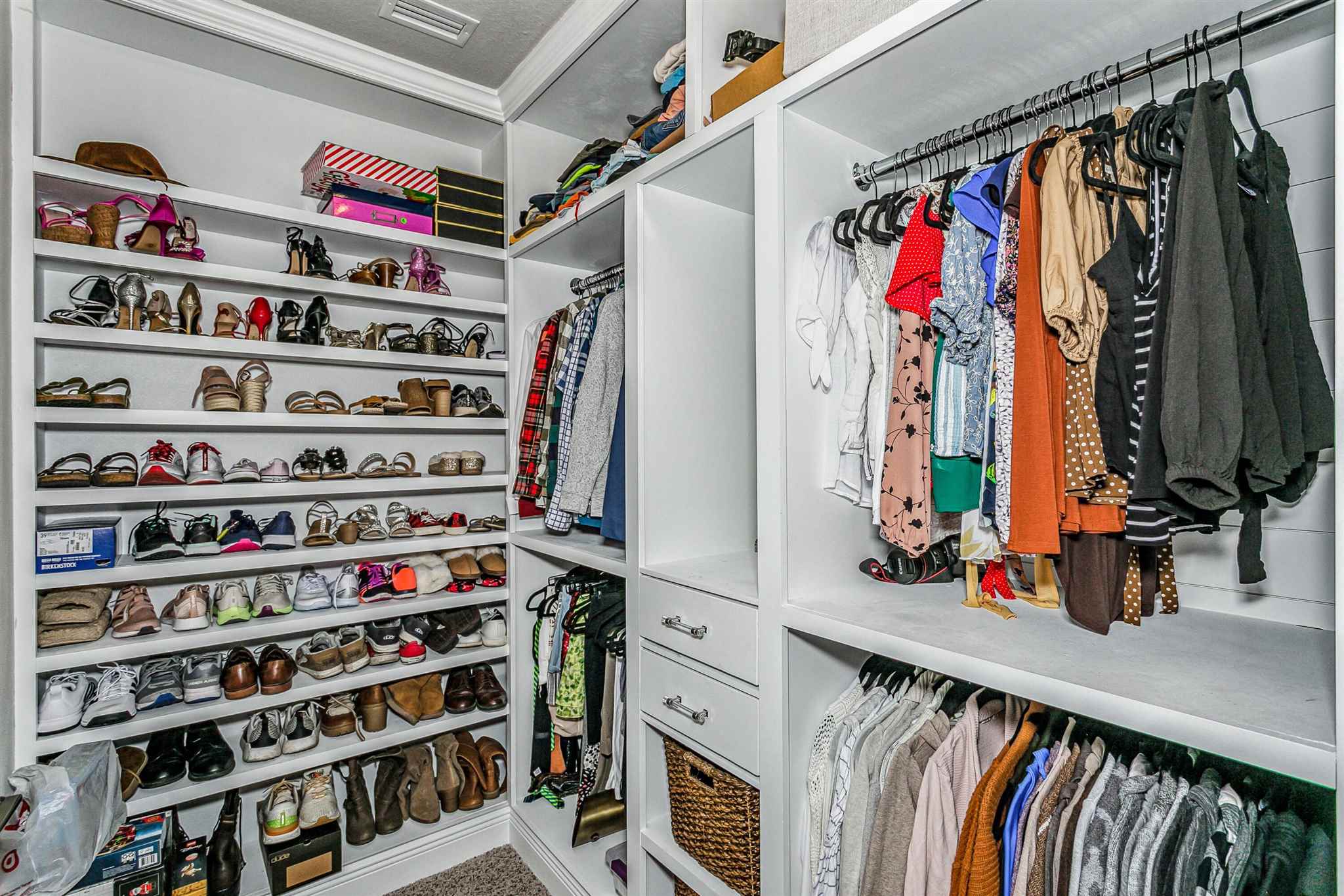 2792 Elkhorn Drive Pace, FL 32571 - Photo 31 of 50 a view of walk in closet with clothes and shoes