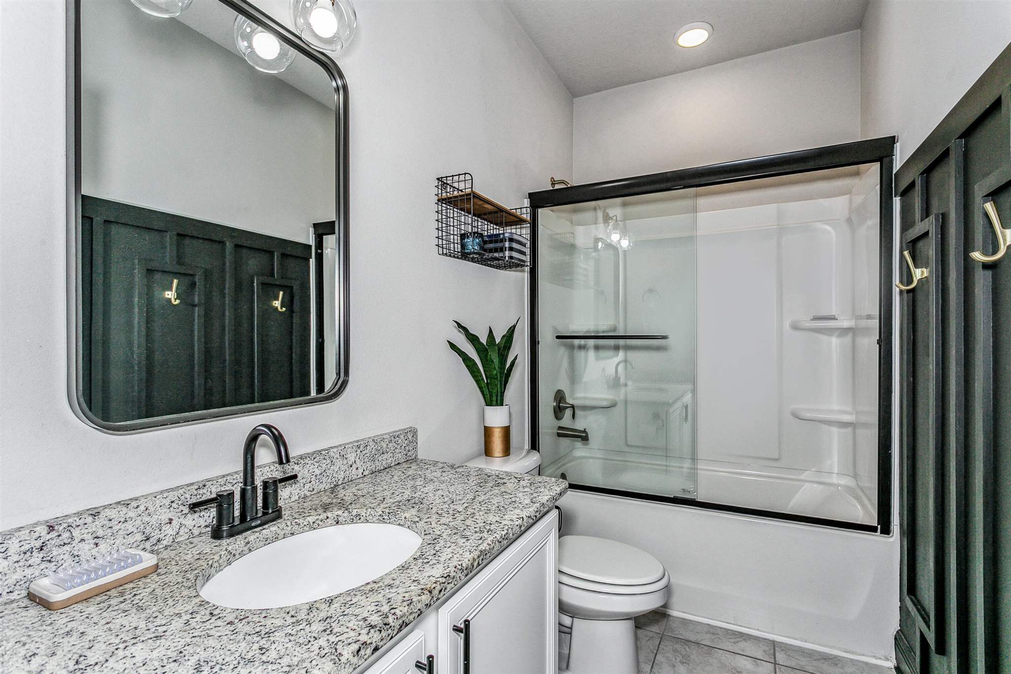 2792 Elkhorn Drive Pace, FL 32571 - Photo 36 of 50 a bathroom with a granite countertop sink toilet and shower