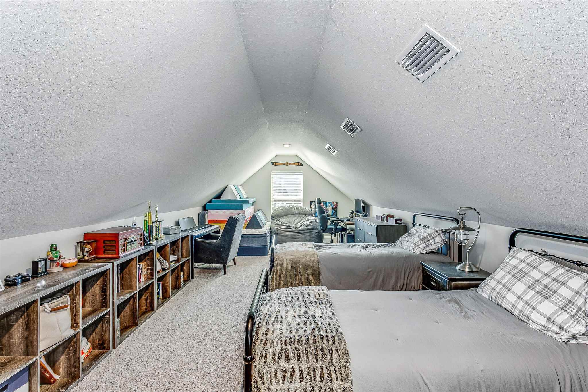 2792 Elkhorn Drive Pace, FL 32571 - Photo 41 of 50 a bedroom with furniture and a book shelf