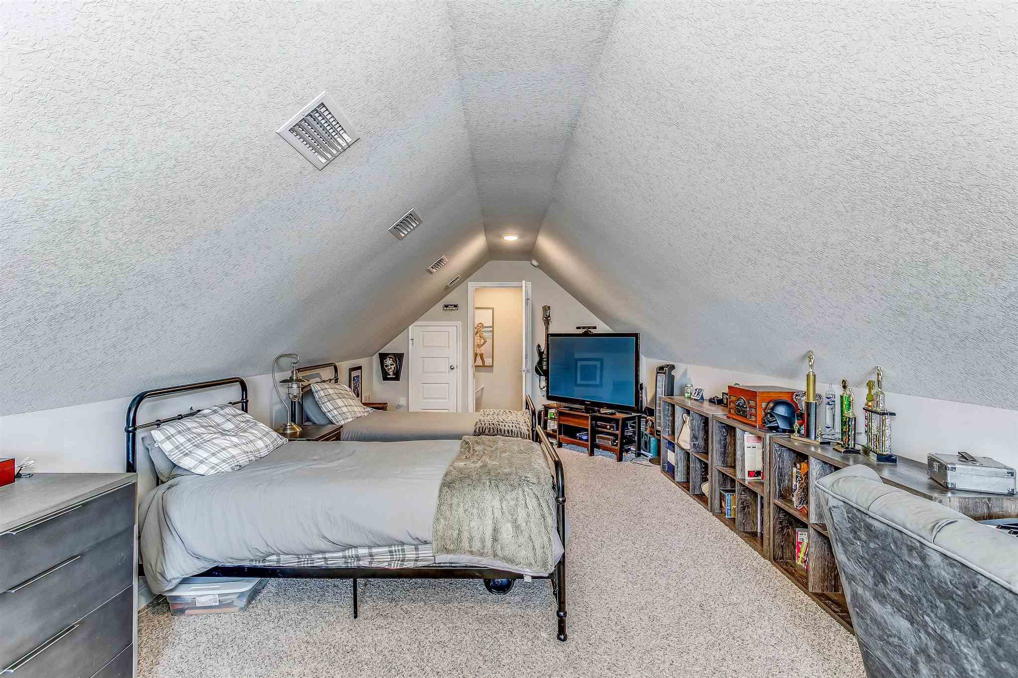 2792 Elkhorn Drive Pace, FL 32571 - Photo 42 of 50 a bedroom with furniture and a book shelf